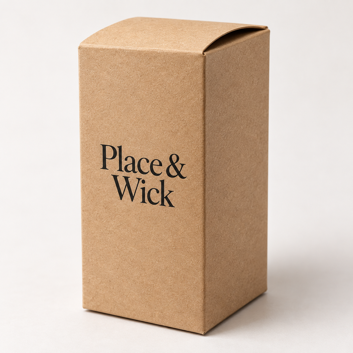A cardboard box with the text "Place & Wick" printed on it.